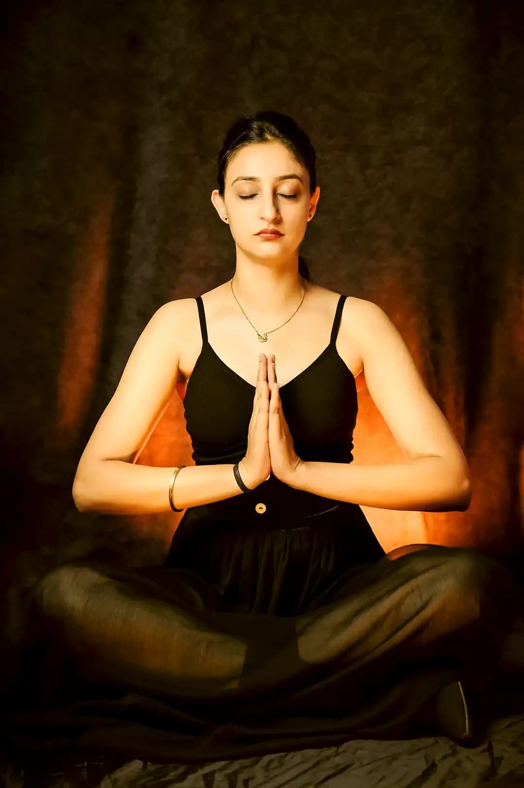 Yoga instructor demonstrating a mindful pose at Vila Ventures studio in Abu Dhabi